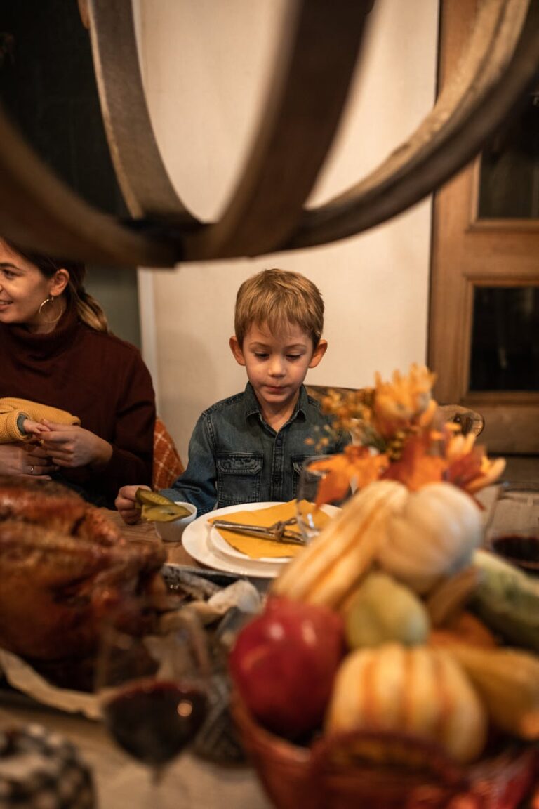 boy in blue denim jacket sitting on chair